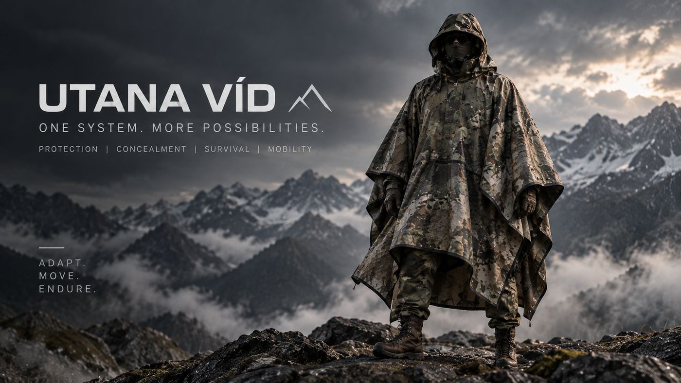 Utana Víd poncho worn on a mountain ridge. Protection, concealment, survival, mobility.